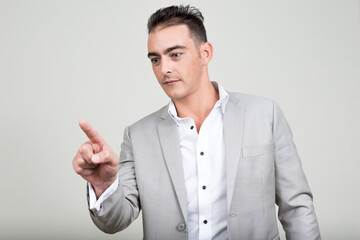 Portrait of young handsome businessman wearing suit