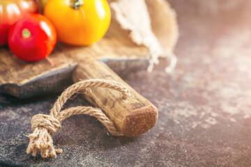 Fresh, ripe multi colored tomatoes on a dark background. Organic food.