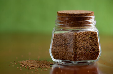 Linseeds in a glass container. Lin seeds