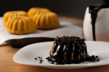 Carrot cake with chocolate syrup in a breakfast table