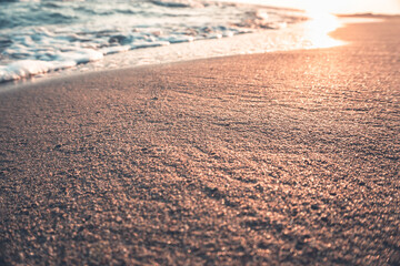 Close up sand at sunset beach. Summer season background.
