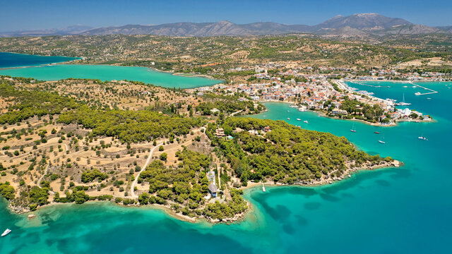 Aerial drone photo of famous fjord seaside village and bay of Porto Heli in the heart of Argolida prefecture, Peloponnese, Greece © aerial-drone