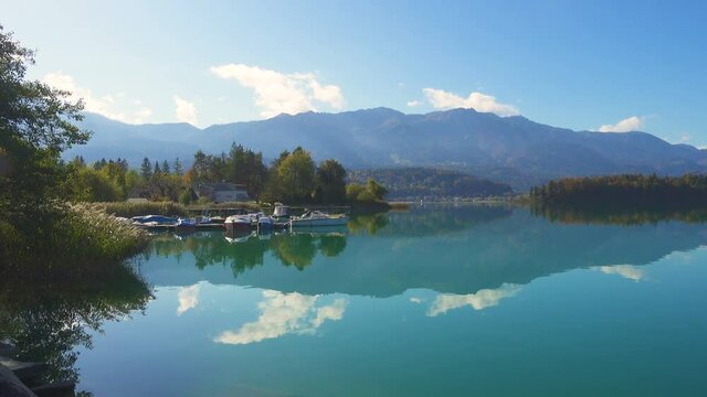 autumn view of austrian lake Faakersee from the viewpoint at the sunny october day
