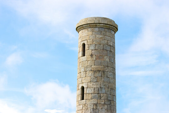 Top of an old castle tower with opened windows