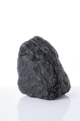 Coal rock on white background. Raw piece of  black stone. 