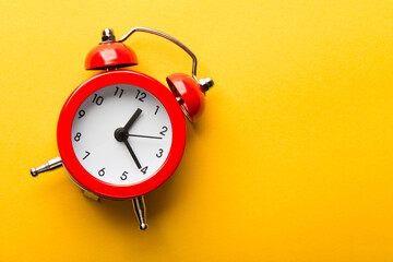Clock Isolated On Yellow Background