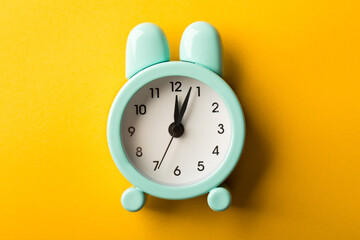 Clock Isolated On Yellow Background