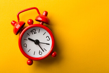 Clock Isolated On Yellow Background