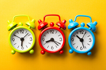 Clocks On The Yellow Background