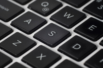 Close up macro view of a keyboard focusing on the letter s