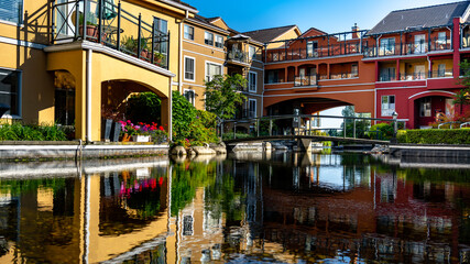 Cityscape of a modern residential area with apartment buildings, new green and watery urban landscape in the city.