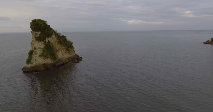 The Small Island in the Shape of a Piece of Cheese very Close to El Morro Beach in the Pacific Ocean in Tumaco, Colombia  