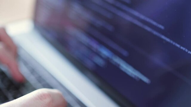 freelance man design web software. Develop internet project. Closeup coding on screen, hands type html code and programming on screen laptop. Hacker work online. Coder testing virus security system.