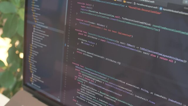 Coder testing virus security system. Develop internet project. freelance man design web software. Closeup coding on screen, hands type html code and programming on screen laptop. Hacker work online.