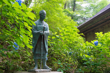 Matsuo Basho Monument at Chusonji Temple in Hiraizumi, Iwate, Japan. Matsuo Basho (1644-1694) was...