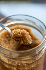 Sugar in the spoon.