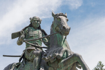 Kanamori Nagachika Statue at Ruins of Tkayama castle in Shiroyama Park. a famous historic site in Takayama, Gifu, Japan.