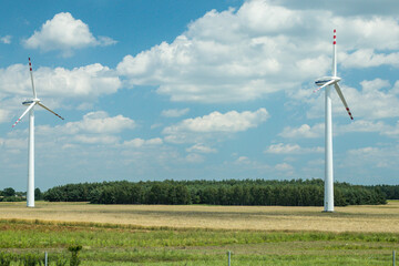 Wind turbines in Poland with some cloudy sky.
