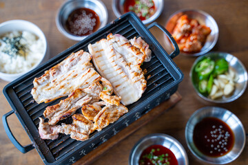 grilled slice poek with charcoal stove