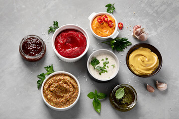 Fototapeta na wymiar Set of various sauces in bowls