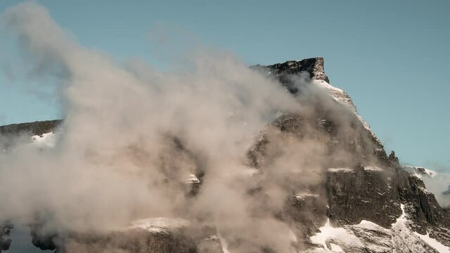 Time lapse captured during the morning of a mountain where clouds are evaporating and moving up hill. Norway, Innderdalen.