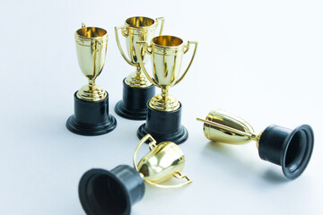 golden winner cups on a white background. Competitions concept.