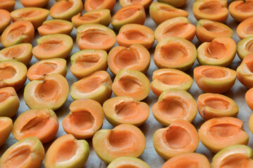 Apricots background. Apricot slices. Fresh organic fruits. Countryside garden harvest. Fruit salad, smoothie, pie and jam ingredient.