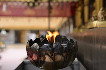 Oil lamp for Buddhist to light a candle and incense in the Temple.