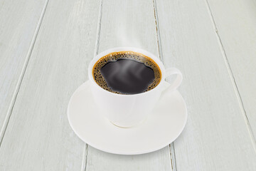White coffee cup on white vintage wooden tabletop background