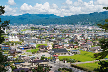 Fototapeta na wymiar Suwa City view from Hokuto Shrine in Suwa, Nagano Prefecture, Japan.