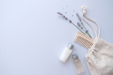 Composition with lavender and organic cosmetics In eco bag on blue background. Organic SPA beauty...