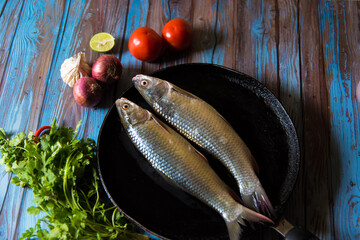 Fresh fish or raw fish along with ingredients and condiments.