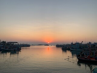 Waterfront atmosphere Sunrise fishing boat