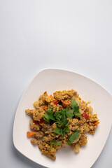 Stir-fried minced pork curry powder in a white plate