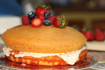 Strawberry jam cake with berries