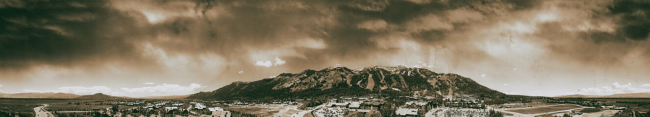 Fototapeta premium Amazing panoramic sunset aerial view of Jackson Hole cityscape in summertime, WY, USA