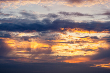 Fototapeta na wymiar Dramatic sunset in orange and violet colors