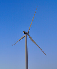 wind generators generate energy against the sky