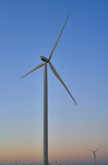 Fototapeta premium wind generators generate energy against the sky
