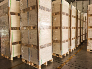 Shipment cartons box on pallets and wooden case on forklift in interior warehouse cargo for export and sorting goods in freight logistics and transportation industrial