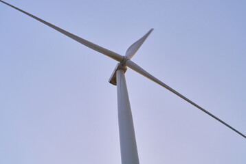 wind generators generate energy against the sky