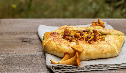 Freshly baked open pie made from mushrooms and potatoes