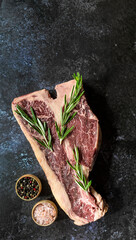 Thick Raw T-Bone Steak. Vertical orientation.