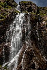 waterfall in the mountains, Small waterfall near the cave in mountains
