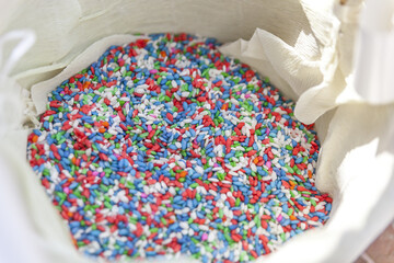 red, blue, white and green colored sugared almonds