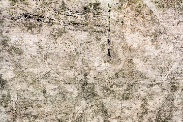 Texture of a concrete wall with cracks and scratches which can be used as a background