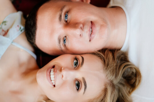 close up. view top. happy couple of young lovers lying on floor and relax.