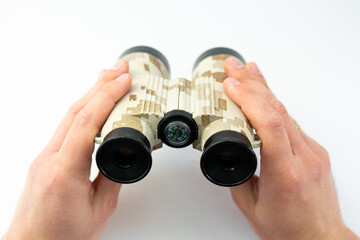 binoculars in hands on a white background