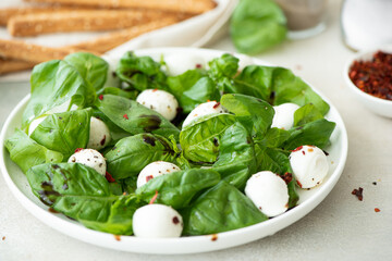 small mozzarella balls with basil and balsamic vinegar