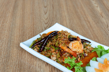 Winged Bean Salad on table in restaurant. Thai food.